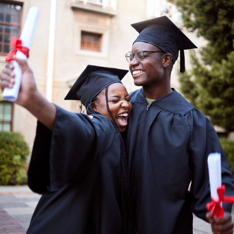 Black students, hug and celebration for graduation, education and achievement on university, campus and success